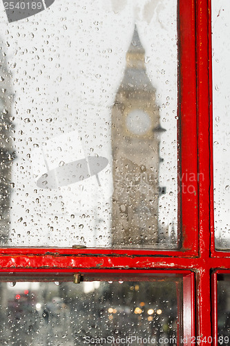 Image of Big ben and red phone cabine. Rainy day