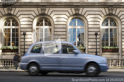 Image of Taxi in motion in London