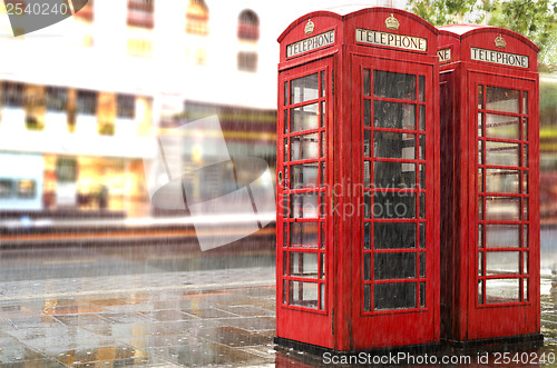 Image of Rainy day.Red Phone cabines in London