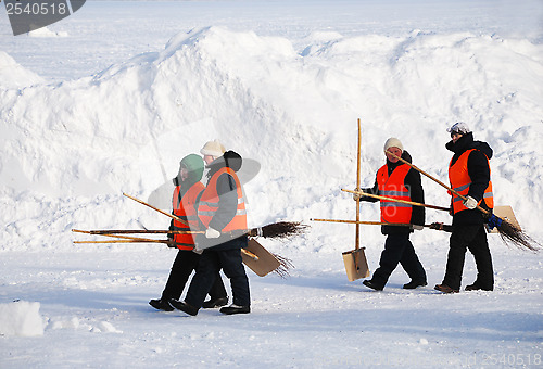 Image of PETROZAVODSK, RUSSIA ? FEBRUARY 18: janitors with shovels and br