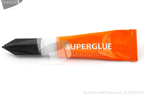 Image of orange plastic tube labeled superglue