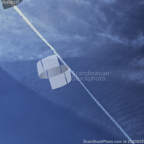 Image of smoke trail on cloudy sky