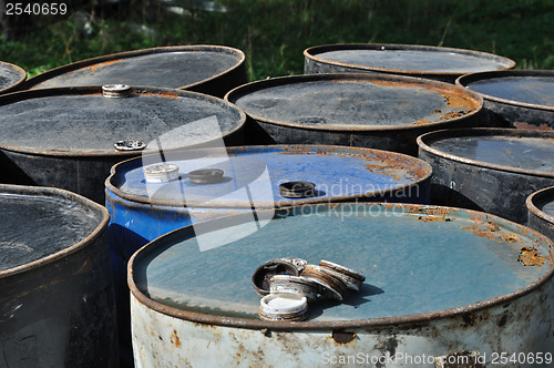 Image of rusty metal barrels