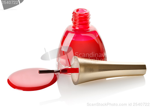 Image of Red nail polish and brush