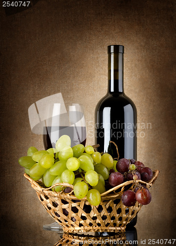 Image of Wine and grapes in basket