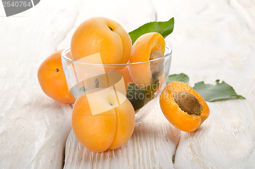 Image of Apricots on a wooden background