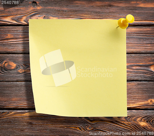 Image of Notebook on a wooden wall