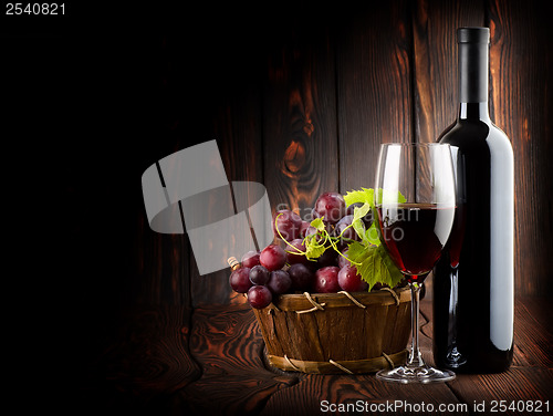 Image of Wine on the dark wooden background