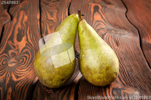 Image of Two pears wooden on an background