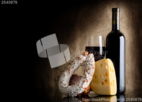 Image of Wine bottle and cheese
