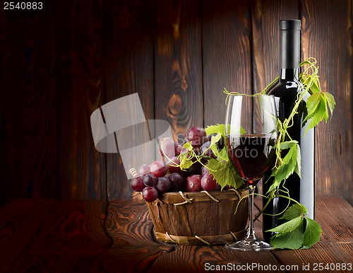 Image of Wine set on wooden background