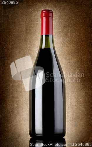 Image of Bottle of wine on the old background