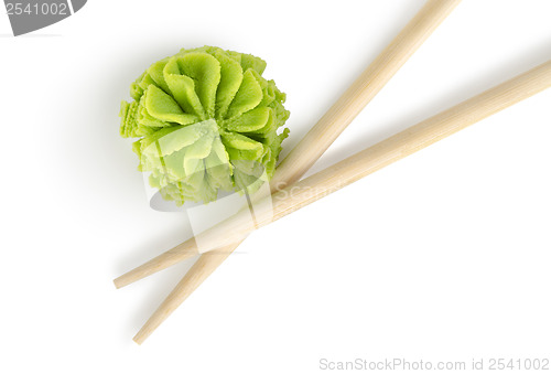 Image of Wooden chopsticks and wasabi isolated