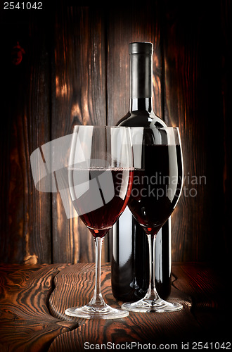 Image of Two glasses of wine and wine bottle