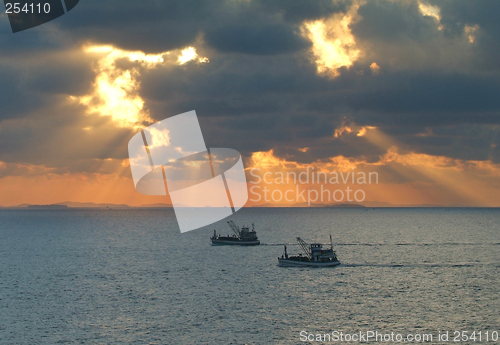 Image of Fishing boats at sunrise
