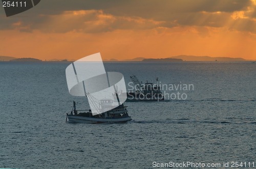 Image of Fishing boats at sunrise