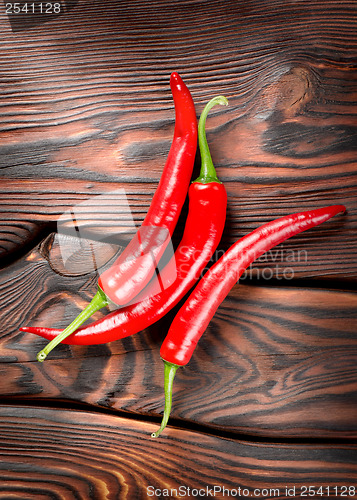 Image of Chili on a wooden background