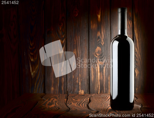 Image of Bottle on a wooden background