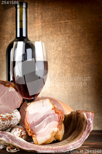 Image of Wine and meat on a canvas