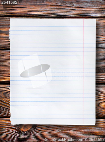 Image of Lined paper on dark table