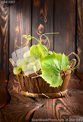 Image of Grapes on a wooden background