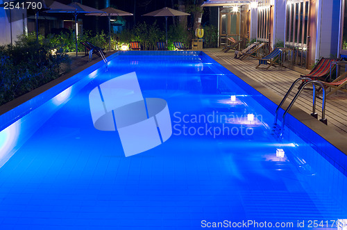 Image of pretty swimming pool in night at a local resort