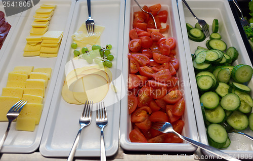 Image of vegetables and cheese on the trays