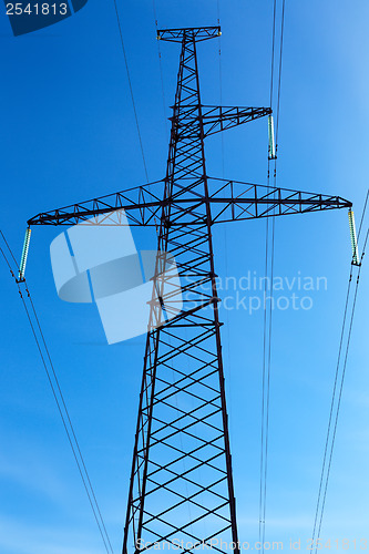 Image of High-voltage line on blue sky background