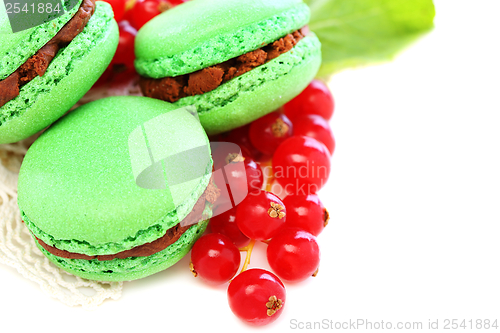 Image of Macarons stuffed with chocolate and mint.