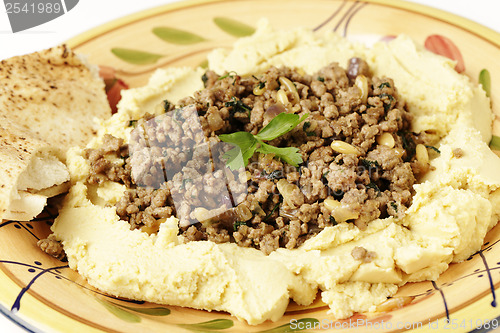 Image of Hummus with meat and pine nuts