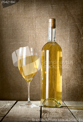 Image of Dessert wine and glass on the canvas