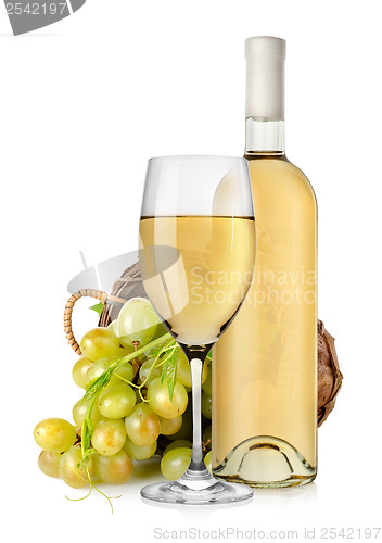 Image of White wine bottle and grapes in basket