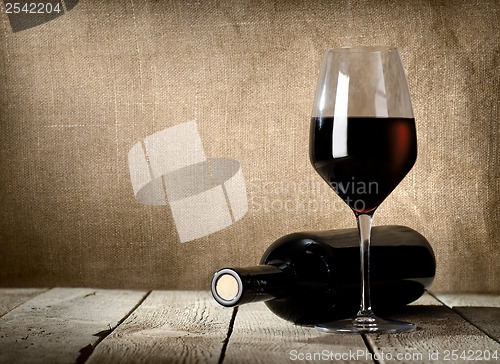 Image of Black bottle and red wine