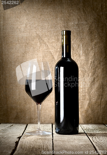 Image of Black bottle and glass