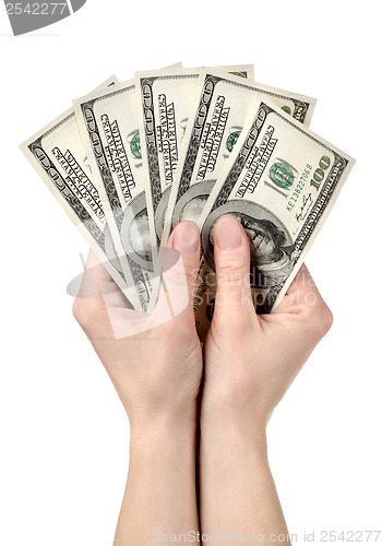 Image of Hands holds hundreds of dollars