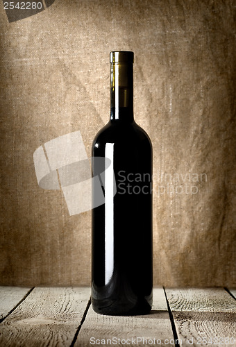 Image of Black bottle of red wine