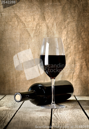 Image of Black bottle of wine and wneglass