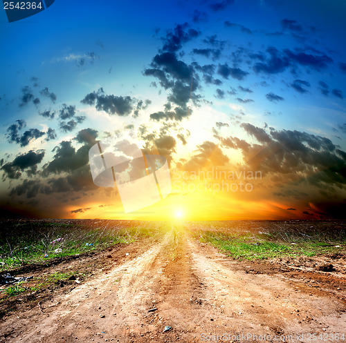 Image of Country road and cumulus clouds