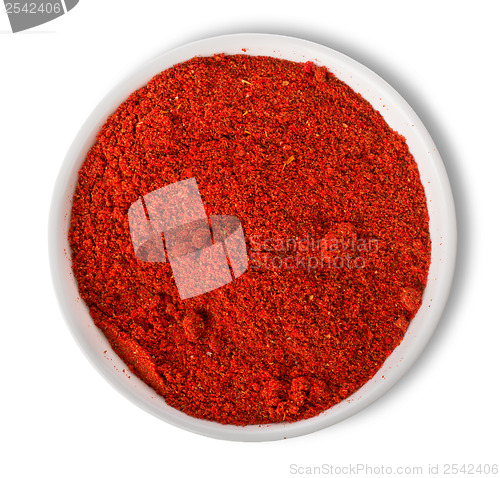 Image of Ground paprika in plate isolated