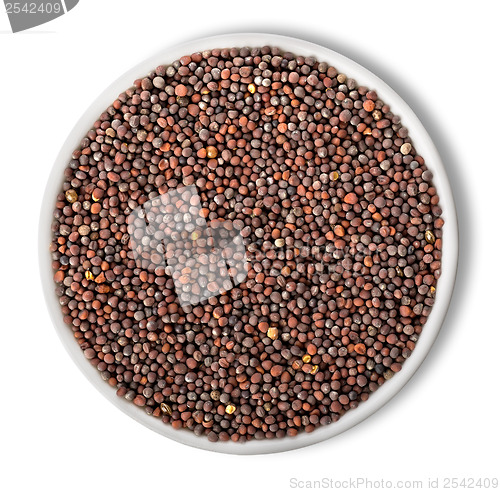 Image of Black mustard seeds in plate isolated