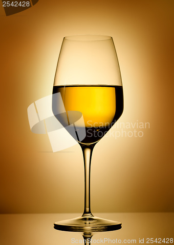 Image of Wine glass  over gold background