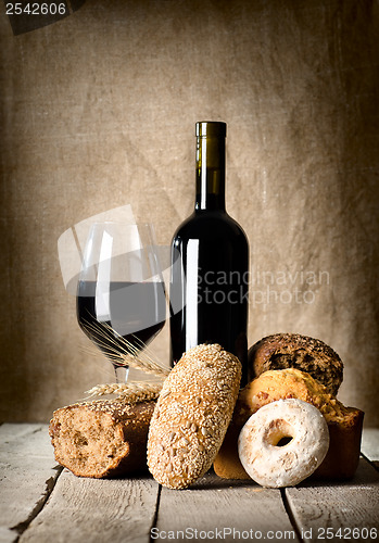 Image of Wine and assortment of bread