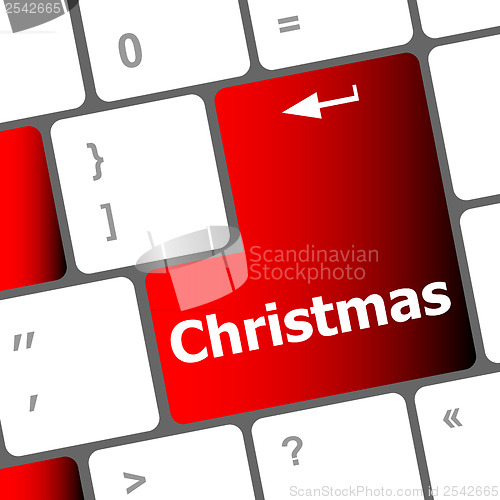Image of christmas button on the keyboard key - holiday concept