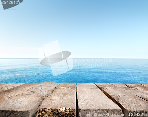 Image of Blue sea and wooden pier