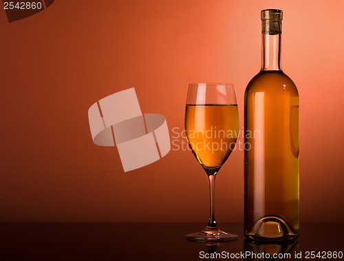 Image of White wine on a brown background