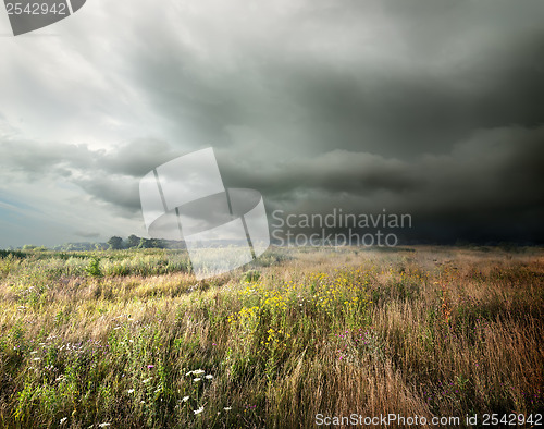 Image of Storm clouds over field 