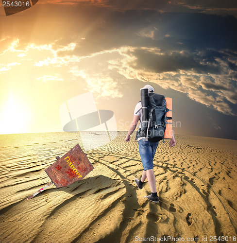 Image of Man traveling in desert