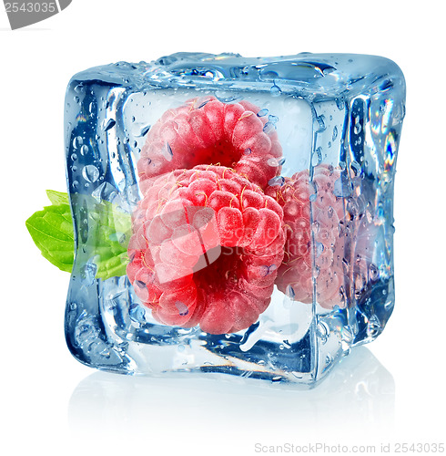 Image of Ice cube and raspberries isolated