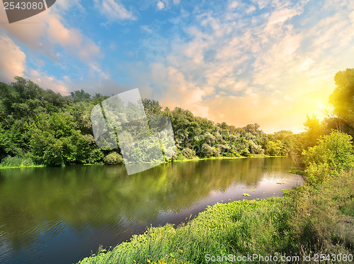 Image of Sun in the clouds above the river