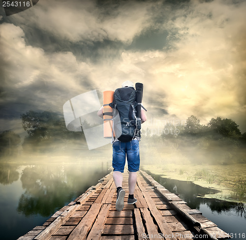 Image of Tourist on the wooden bridge